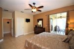 King master bedroom with doors to the pool